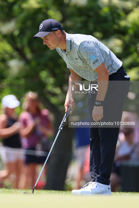 Jordan Spieth of Dallas, Texas lines up his putt on the 9th green during the final round of The Memorial Tournament presented by Workday at...