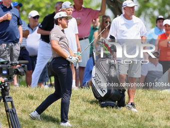 Garrick Higgo of Stellenbosch, South Africa follows his shot from the rough near the spectators during The Memorial Tournament presented by...