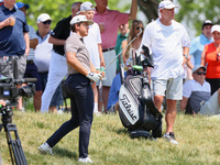 Garrick Higgo of Stellenbosch, South Africa follows his shot from the rough near the spectators during The Memorial Tournament presented by...