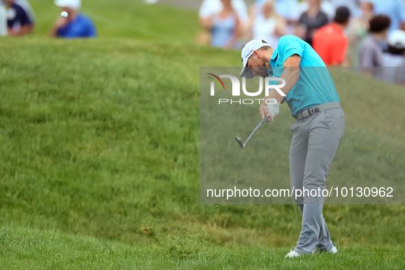 Wyndham Clark of Denver, Colorado hits from the 185h fairway during The Memorial Tournament presented by Workday at Muirfield Village Golf C...