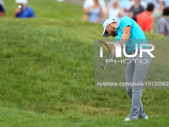 Wyndham Clark of Denver, Colorado hits from the 185h fairway during The Memorial Tournament presented by Workday at Muirfield Village Golf C...