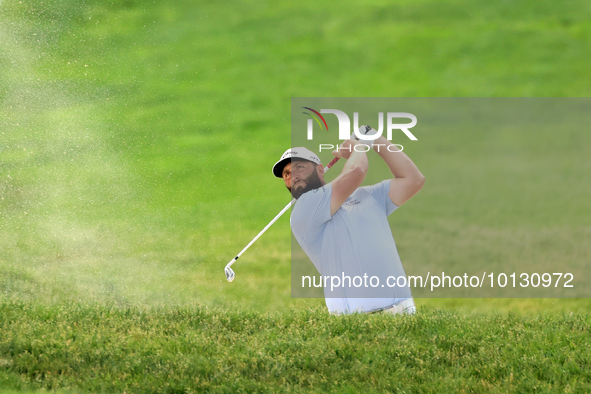 Jon Rahm of Barrika, Spain hits from a bunker on the 18th fairway during The Memorial Tournament presented by Workday at Muirfield Village G...