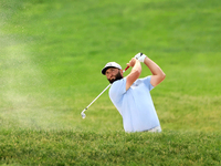 Jon Rahm of Barrika, Spain hits from a bunker on the 18th fairway during The Memorial Tournament presented by Workday at Muirfield Village G...