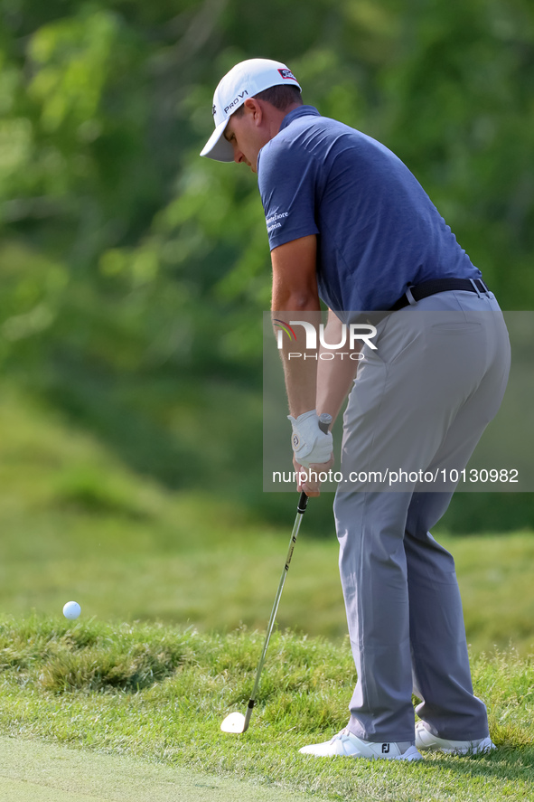 Joseph Bramlett of Las Vegas, Nevada chips onto the 18th green after completing the second round during  The Memorial Tournament presented b...