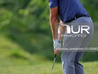 Joseph Bramlett of Las Vegas, Nevada chips onto the 18th green after completing the second round during  The Memorial Tournament presented b...