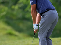 Joseph Bramlett of Las Vegas, Nevada chips onto the 18th green after completing the second round during  The Memorial Tournament presented b...