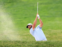 Jon Rahm of Barrika, Spain hits from a bunker on the 18th fairway during The Memorial Tournament presented by Workday at Muirfield Village G...