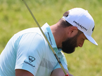 John Rahm of Barrika, Spain chips onto the 7th green with Jason Day of Brisbane, Australia during The Memorial Tournament presented by Workd...