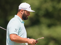 John Rahm of Barrika, Spain looks over the 8th green with Jason Day of Brisbane, Australia during The Memorial Tournament presented by Workd...