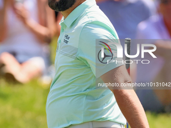 John Rahm of Barrika, Spain reacts after making his putt on the 9th green during  The Memorial Tournament presented by Workday at Muirfield...