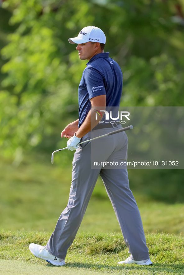 Joseph Bramlett of Las Vegas, Nevada walks on the 18th green after completing the second round during  The Memorial Tournament presented by...