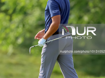 Joseph Bramlett of Las Vegas, Nevada walks on the 18th green after completing the second round during  The Memorial Tournament presented by...