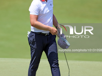 Matt Wallace of England walks on the 18th green after completing the first round of the The Memorial Tournament presented by Workday at Muir...