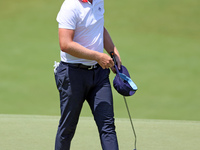 Matt Wallace of England walks on the 18th green after completing the first round of the The Memorial Tournament presented by Workday at Muir...