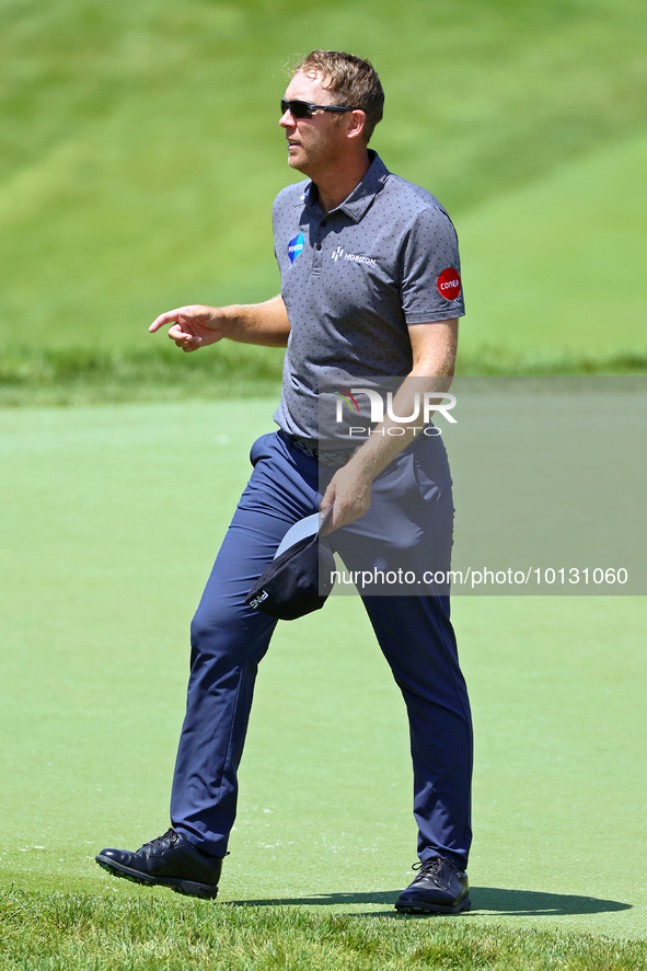 Seamus Power of Waterford, Ireland walks off the 18th green after completing the first round of the The Memorial Tournament presented by Wor...