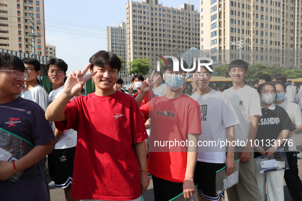  Students cheer for themselves at a college entrance examination site in Lianyungang, Jiangsu province, China, on June 7, 2023. 