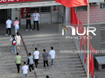  Students enter a national college entrance examination center in Bazhou, Xinjiang province, China, on June 7, 2023. (