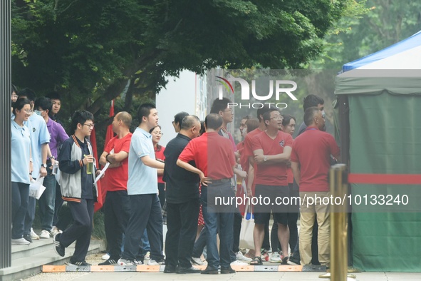 HANGZHOU, CHINA - JUNE 7, 2023 - Students pass through a security gate at a test center for the National College entrance examination in Han...