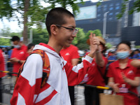 Candidates walk into the entrance examination center of the High School Affiliated to Beijing People's Congress for the National College Ent...