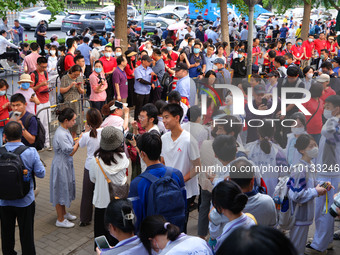 Candidates walk into the entrance examination center of the High School Affiliated to Beijing People's Congress for the National College Ent...