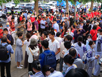 Candidates walk into the entrance examination center of the High School Affiliated to Beijing People's Congress for the National College Ent...