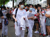 Candidates walk into the entrance examination center of the High School Affiliated to Beijing People's Congress for the National College Ent...