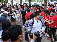 Candidates walk into the entrance examination center of the High School Affiliated to Beijing People's Congress for the National College Ent...