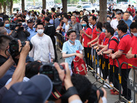 Candidates walk into the entrance examination center of the High School Affiliated to Beijing People's Congress for the National College Ent...