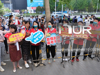 Candidates walk into the entrance examination center of the High School Affiliated to Beijing People's Congress for the National College Ent...