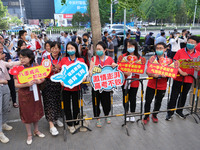 Candidates walk into the entrance examination center of the High School Affiliated to Beijing People's Congress for the National College Ent...