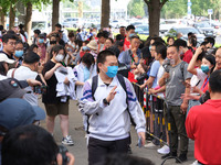 Candidates walk into the entrance examination center of the High School Affiliated to Beijing People's Congress for the National College Ent...