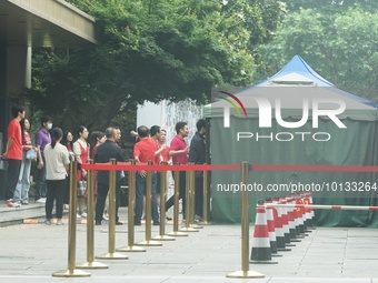 HANGZHOU, CHINA - JUNE 7, 2023 - Students pass through a security gate at a test center for the National College entrance examination in Han...