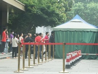 HANGZHOU, CHINA - JUNE 7, 2023 - Students pass through a security gate at a test center for the National College entrance examination in Han...