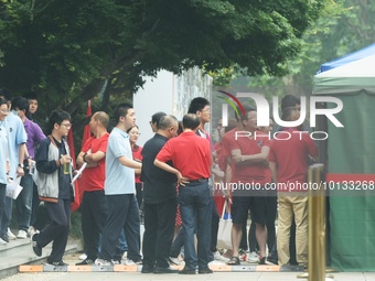 HANGZHOU, CHINA - JUNE 7, 2023 - Students pass through a security gate at a test center for the National College entrance examination in Han...