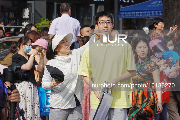 Candidates walk into a test room with admission tickets in Changzhou, Jiangsu province, China, on June 7, 2023. The 2023 National college en...