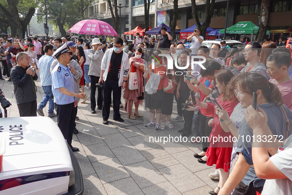 Candidates walk into a test room with admission tickets in Changzhou, Jiangsu province, China, on June 7, 2023. The 2023 National college en...