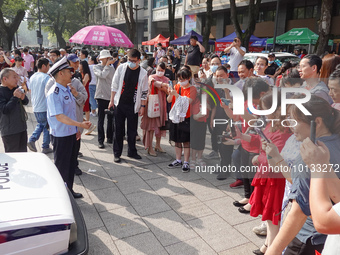 Candidates walk into a test room with admission tickets in Changzhou, Jiangsu province, China, on June 7, 2023. The 2023 National college en...