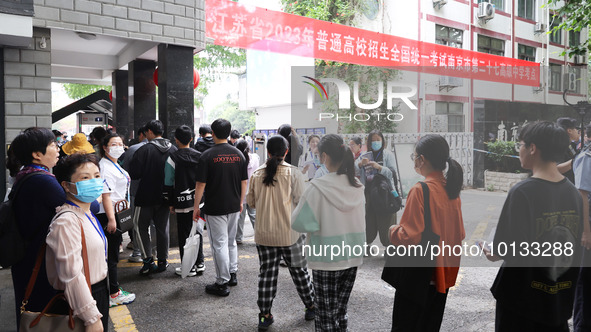  Candidates line up for the entrance exam at the 27th Senior High School in Nanjing, East China's Jiangsu province, on June 7, 2023. The 202...