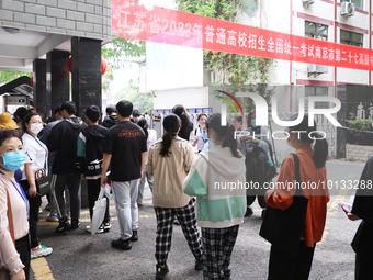  Candidates line up for the entrance exam at the 27th Senior High School in Nanjing, East China's Jiangsu province, on June 7, 2023. The 202...