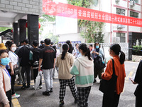  Candidates line up for the entrance exam at the 27th Senior High School in Nanjing, East China's Jiangsu province, on June 7, 2023. The 202...