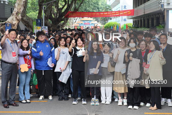  Candidates pose for a group photo with teachers at the Nanjing No. 9 Middle School exam center in Nanjing, East China's Jiangsu province, o...