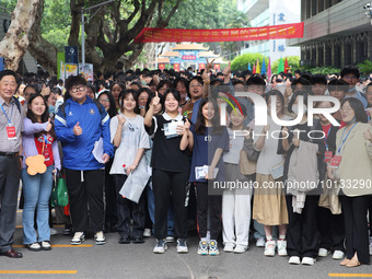  Candidates pose for a group photo with teachers at the Nanjing No. 9 Middle School exam center in Nanjing, East China's Jiangsu province, o...