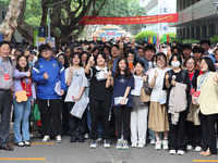  Candidates pose for a group photo with teachers at the Nanjing No. 9 Middle School exam center in Nanjing, East China's Jiangsu province, o...