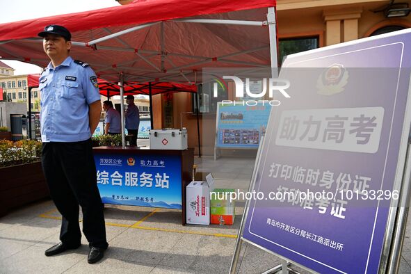 QINGDAO, CHINA - JUNE 7, 2023 - Traffic police direct traffic in front of a college entrance exam site in Qingdao, Shandong province, China,...