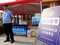 QINGDAO, CHINA - JUNE 7, 2023 - Traffic police direct traffic in front of a college entrance exam site in Qingdao, Shandong province, China,...