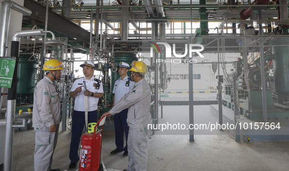 

Members of the emergency response team of a chemical enterprise are conducting a drill for plugging a leak in a pipeline in Huai'an City,...