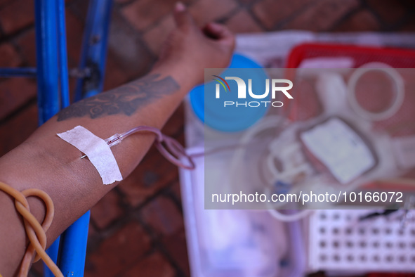 A Nepali blood donor donates blood in a blood donation campaign organized at Patan Durbar Square, a UNESCO World Heritage Site on the occasi...