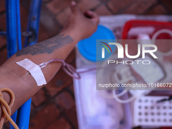 A Nepali blood donor donates blood in a blood donation campaign organized at Patan Durbar Square, a UNESCO World Heritage Site on the occasi...