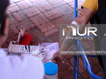 A Nepali blood donor donates blood in a blood donation campaign organized at Patan Durbar Square, a UNESCO World Heritage Site on the occasi...