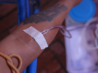 A Nepali blood donor donates blood in a blood donation campaign organized at Patan Durbar Square, a UNESCO World Heritage Site on the occasi...